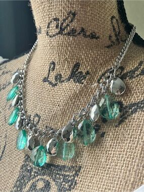 Iridescent green beaded necklace.